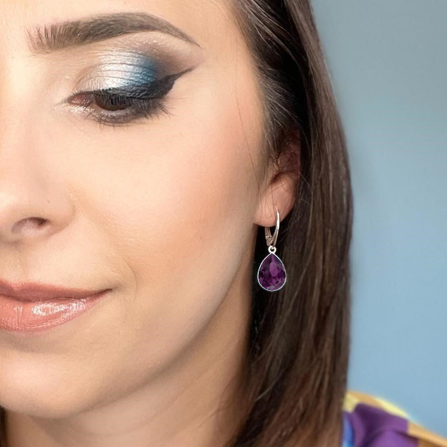 Woman wearing Sterling Silver Teardrop Earrings with Amethyst Purple Pear-Cut Crystals from Austria, made by Magpie Gems in Ireland