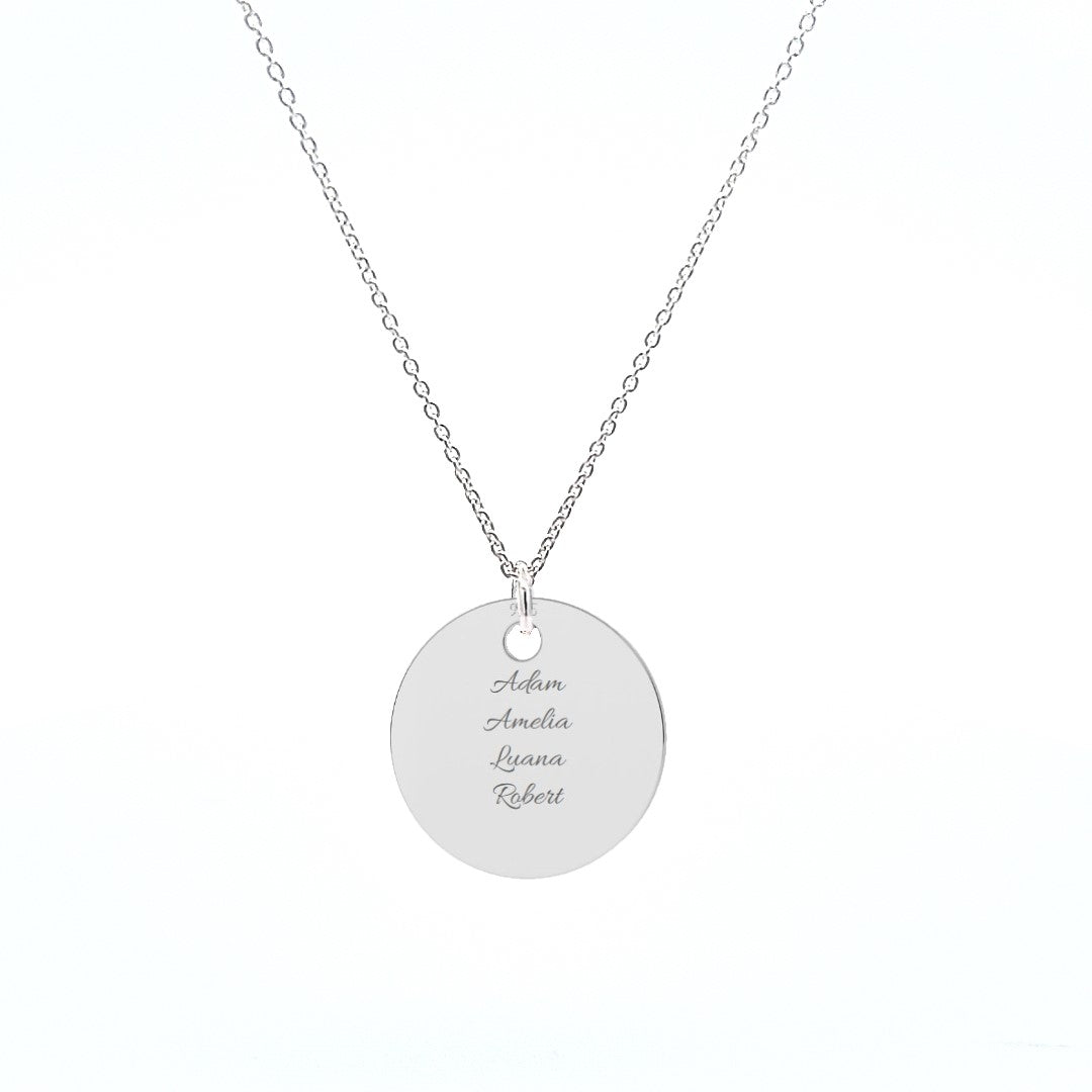 Sterling silver pendant engraved with four names, featuring a simple yet elegant circular design.