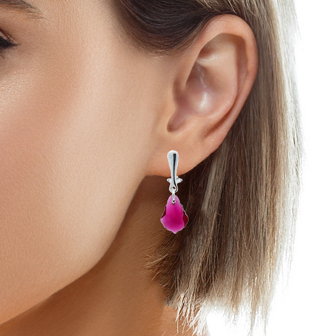 Woman wearing a Sterling Silver Baroque Crystal Clip-On Earrings in Ruby Red