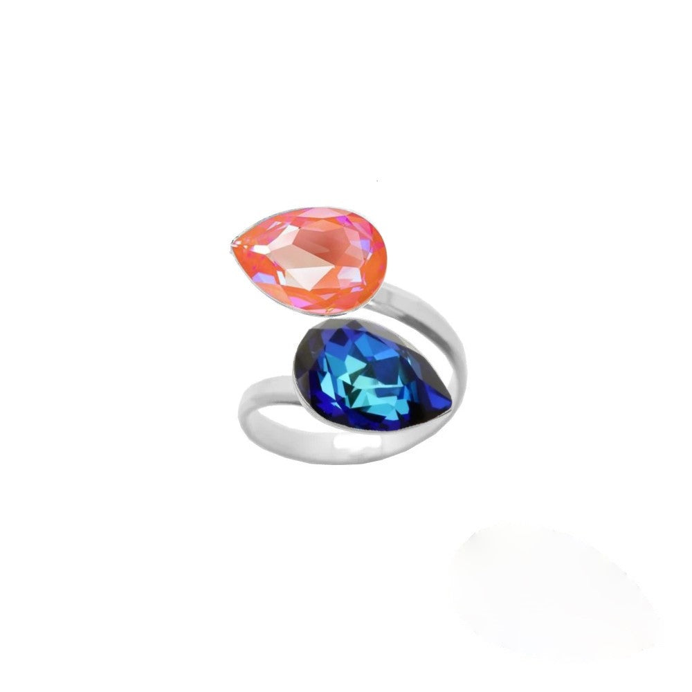 Delicate and stylish, this 925 Sterling silver wrap-around ring for women features Bermuda Blue and Orange Glow DeLite teardrop crystals, lovingly handcrafted by Magpie Gems in Ireland.