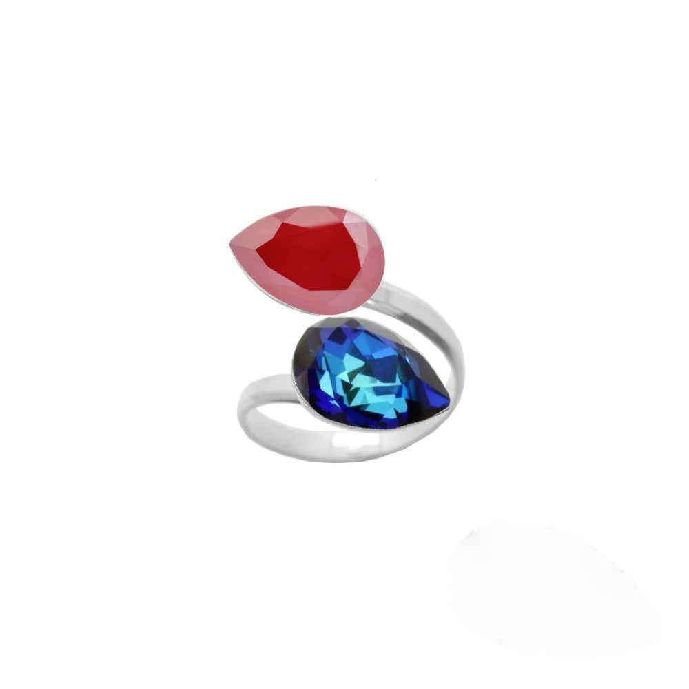 Elegant dual crystal ring for women, crafted from 925 Sterling silver with Bermuda Blue and Royal Red pear-cut crystals, wrapped delicately around the finger, handmade by Magpie Gems in Ireland.