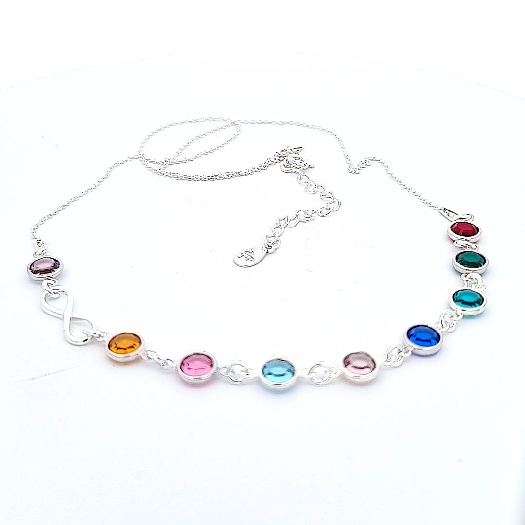 Close-up image of 'Legacy of Love' necklace showing detailed craftsmanship of the nickel-free sterling silver and precise placement of multicolored Austrian crystal birthstones.