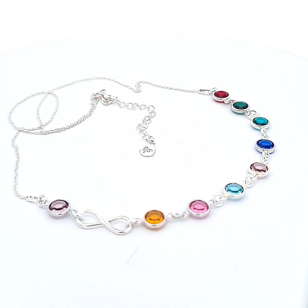 Magpie Gems 'Legacy of Love' Grandmother Birthstone Infinity Necklace on white background, showcasing nickel-free sterling silver with colourful Austrian crystals.