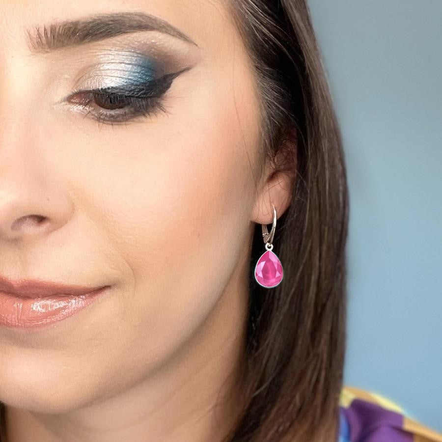 Woman wearing Sterling Silver Teardrop Earrings with Peony Pink Pear-Cut Crystals from Austria, made by Magpie Gems in Ireland