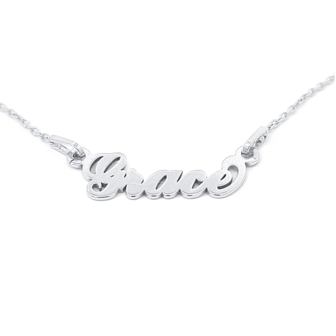 Personalised Irish name necklace in sterling silver, featuring names with fadas, perfect for celebrating cultural heritage.