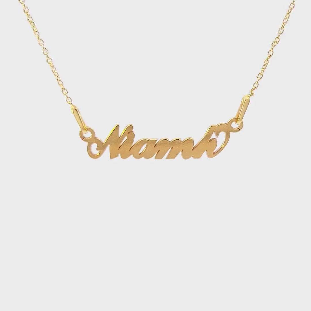 Video displaying a Gold Name Necklace with the name Niamh cut in gold plated sterling silver in Ireland