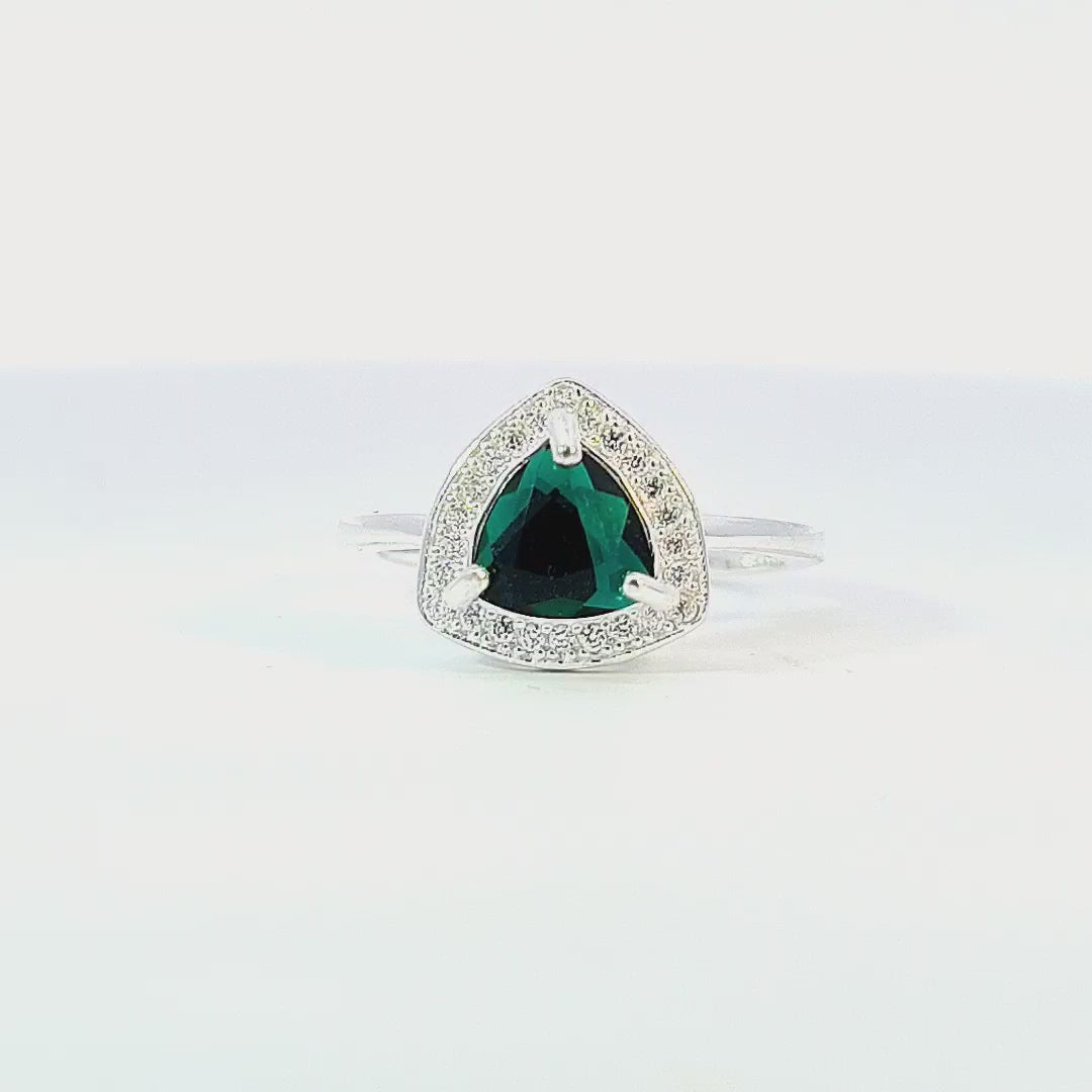 Video showcasing the trilliant-cut Austrian Emerald crystal surrounded by clear crystal halo on sterling silver ring.