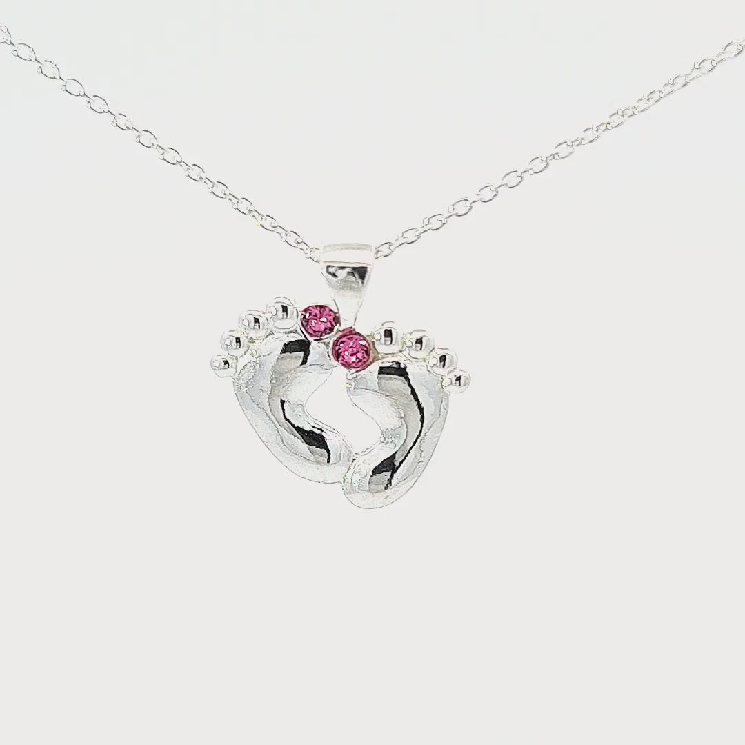 Video showcasing the Sterling silver baby loss necklace with baby feet charm pendant and pink Austrian crystals for a baby or child loss by Magpie Gems in Ireland