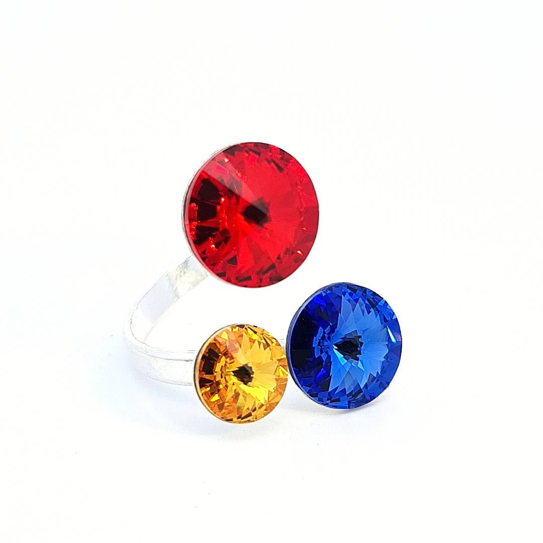 Magpie Gems' 'Triad of Light' Adjustable Silver Ring with Red, Yellow, and Blue Austrian Crystals, embodying strength, wisdom, and joy.