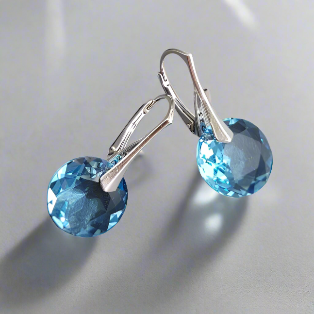 Pair of sterling silver dangle earrings with Aquamarine stone crystal, featuring a delicate drop design, perfect for ladies seeking elegant jewellery from Ireland.