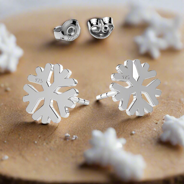 Sterling Silver Snowflake Stud Earrings – artistic display highlighting intricate snowflake design and winter aesthetic for a pair of unisex stud earrings from Ireland.