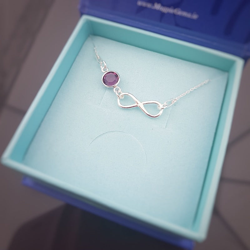 Custom made silver infinity with birthstone crystal pendant necklace for women, with an amethyst birthstone for February