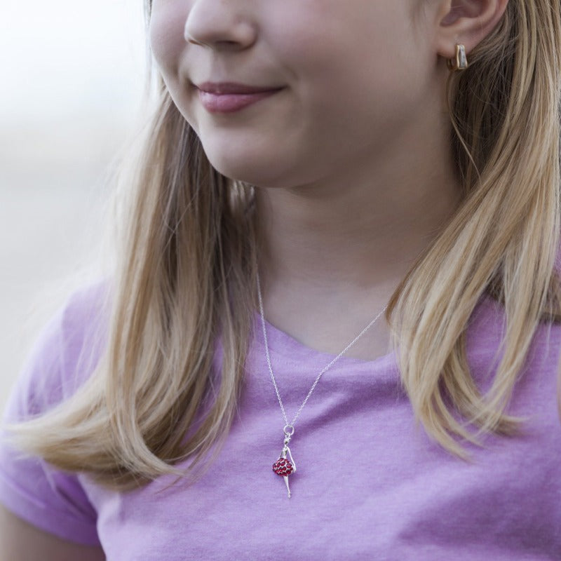 Girl Wearing a Red pave ballerina necklace with fine chain in sterling silver, made local in Castletownroche, Mallow, Cork, Ireland.