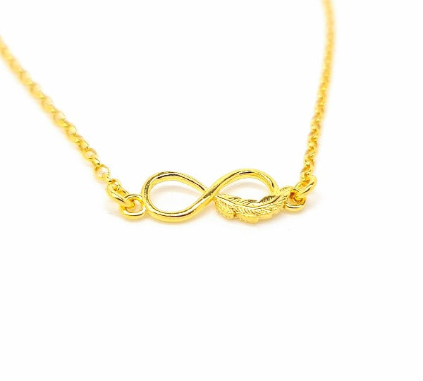 Close-up of Gold Infinity Feather Link on Sterling Silver Anklet