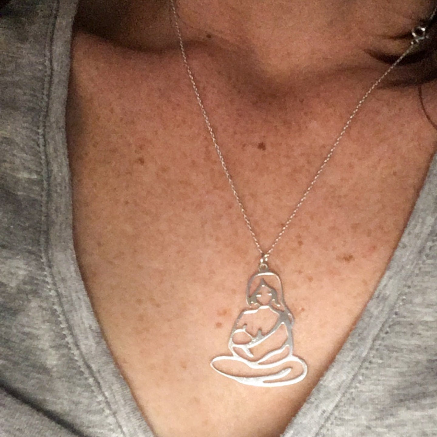 Close-up of Mother Nursing Child Pendant in Sterling Silver