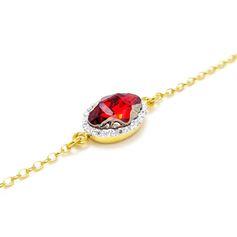 Close-up of Red Oval Tribe Crystal on Solitaire Bracelet with Gold Plated Setting